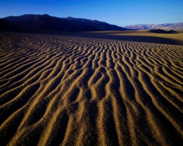 Leading Lines A vast ribbon of parallel lines in the sand lead the eye into the distance at Mesquite Dunes in Death Valley National Park